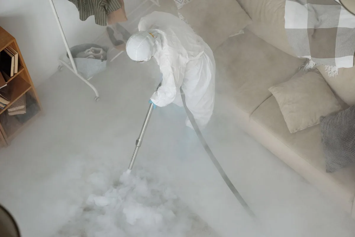 Biohazard cleanup technician in protective equipment, Kingston, PA